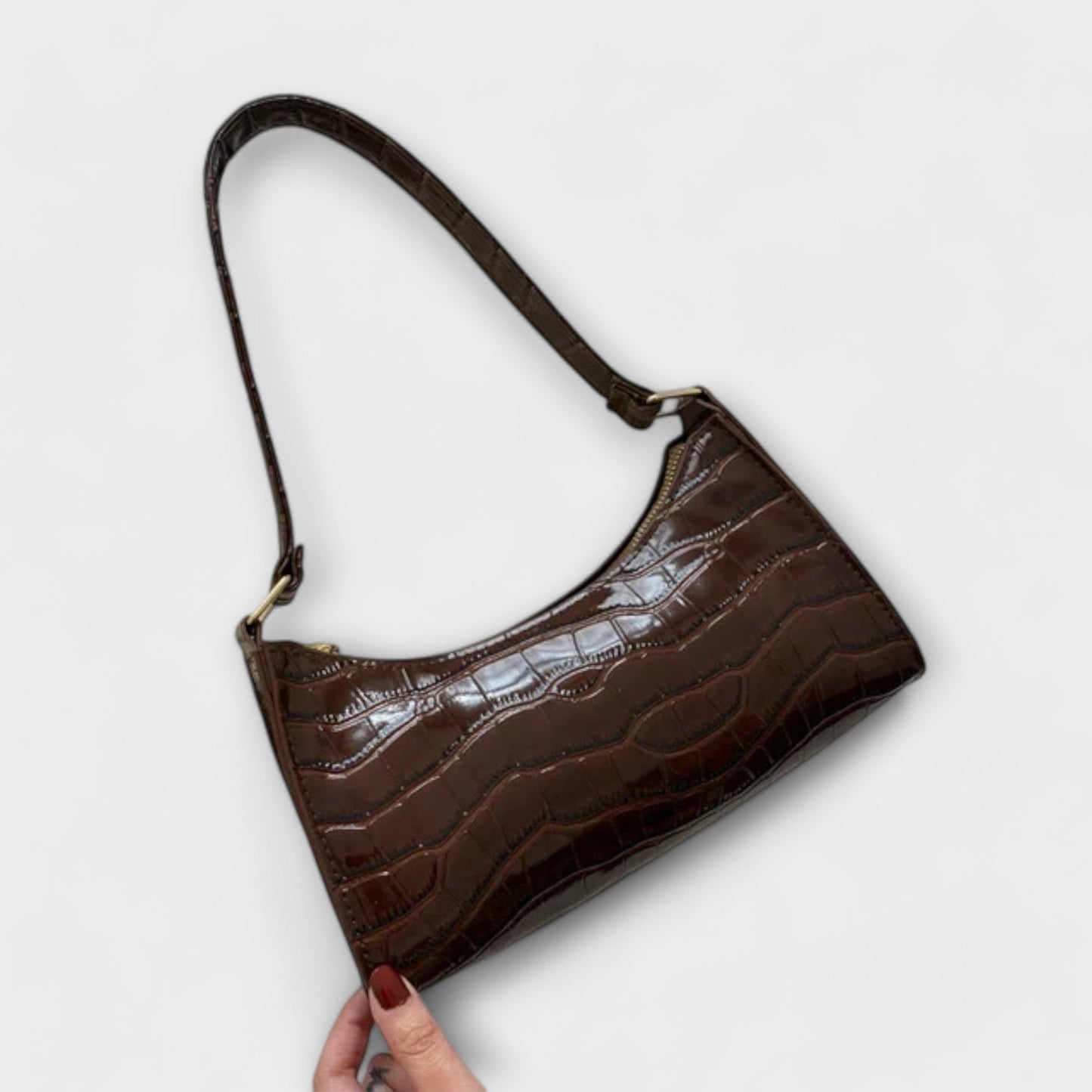 Nora. Glänzende Lederhandtasche